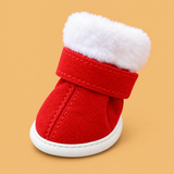 Christmas Red Cotton Dog Paw Shoes — isolated product on a warm peach background