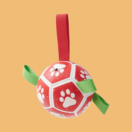 Christmas & Halloween Rope Ball Dog Toy — product on solid #F1BC76 background